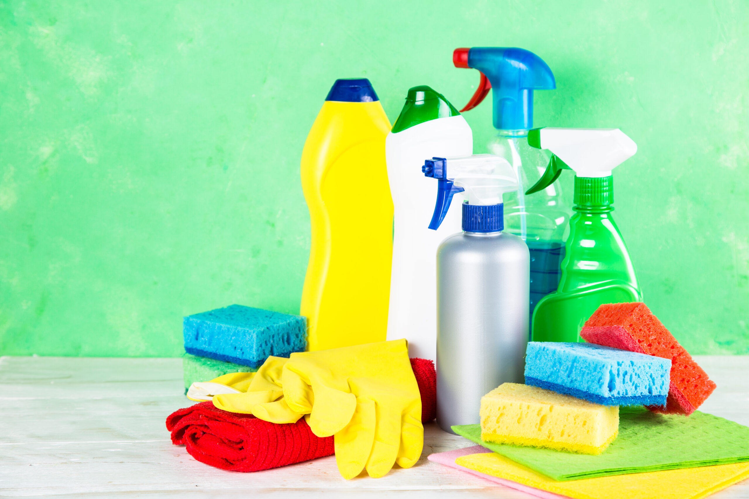 cleaning product, household on green background.